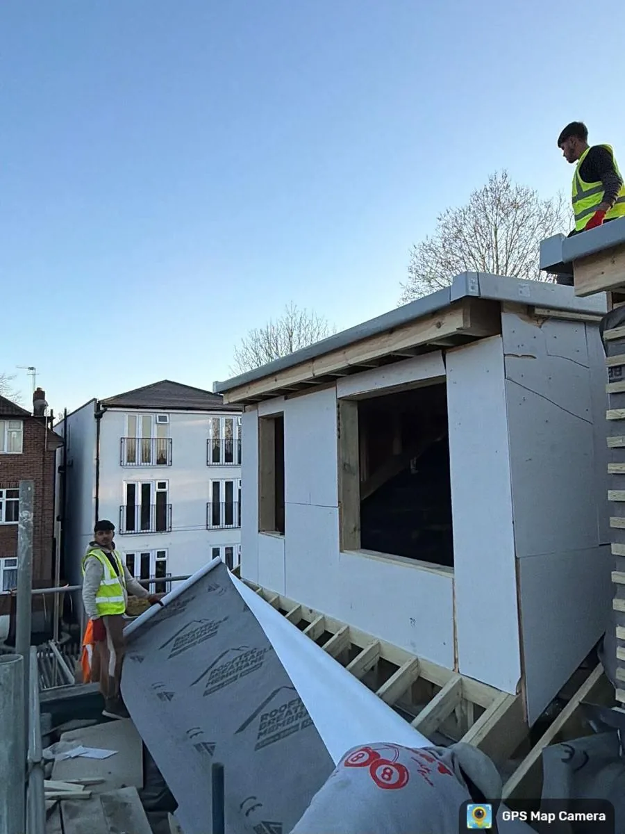 Dormer extension exterior during construction.